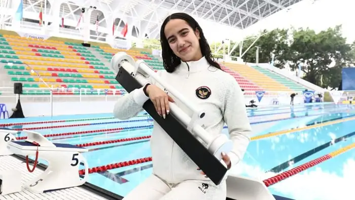 Masniari wolf, ratu gaya punggung berdarah batak-jerman hattrick emas ketiga beruntun sea games 2025 profil masniari wolf, perenang putri indonesia spesialis 50 meter gaya punggung, mencetak hattrick emas sea games, pecahkan rekor nasional.